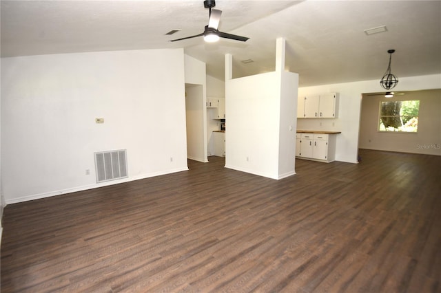 1922 N Torrington Rd N, Avon Park, FL 33825 - unfurnished living room with lofted ceiling, a ceiling fan, and dark wood finished floors