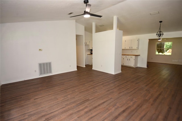 1922 N Torrington Rd N, Avon Park, FL 33825 - unfurnished living room featuring lofted ceiling, a ceiling fan, and dark wood-style flooring