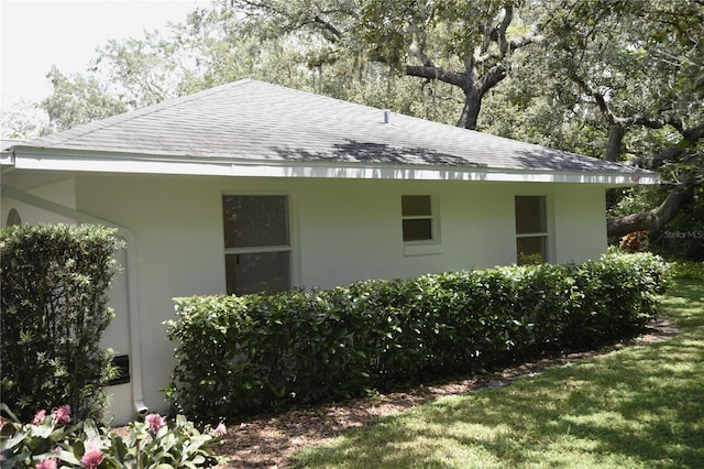 1922 N Torrington Rd N, Avon Park, FL 33825 - view of home's exterior featuring roof with shingles and stucco siding