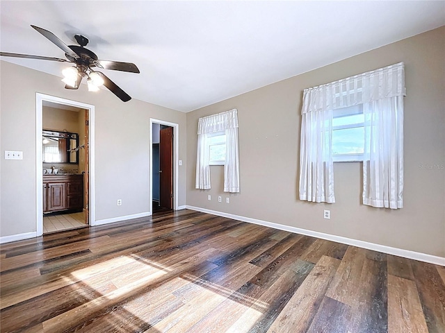 1711 Estes Rd, Bartow, FL 33830 - unfurnished bedroom featuring wood finished floors, connected bathroom, and ceiling fan