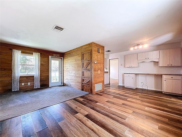 1711 Estes Rd, Bartow, FL 33830 - kitchen with hardwood / wood-style floors, wood walls, and open floor plan