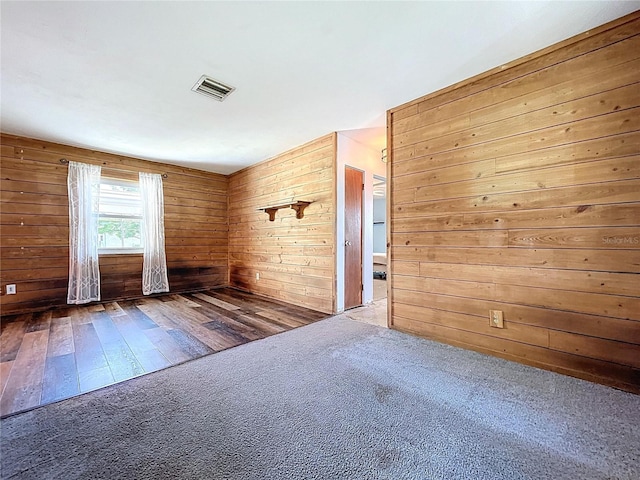 1711 Estes Rd, Bartow, FL 33830 - carpeted spare room with wooden walls and hardwood / wood-style floors