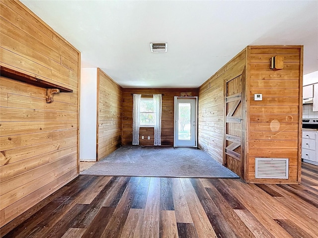 1711 Estes Rd, Bartow, FL 33830 - entrance foyer featuring dark wood-type flooring and wood walls