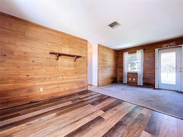 1711 Estes Rd, Bartow, FL 33830 - unfurnished room featuring hardwood / wood-style floors and wooden walls