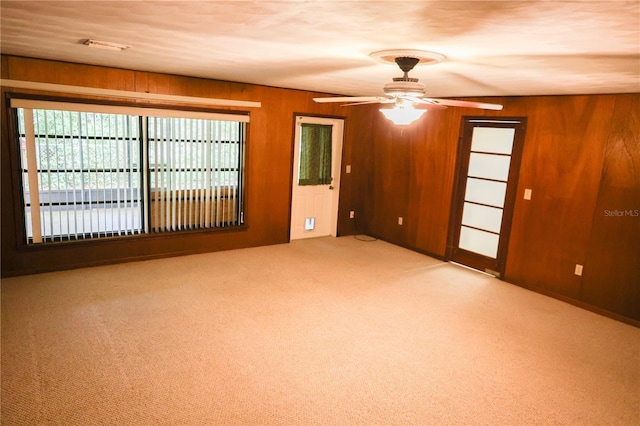 111 Deen Blvd, Auburndale, FL 33823 - spare room with carpet, wooden walls, and ceiling fan