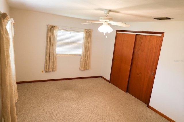 111 Deen Blvd, Auburndale, FL 33823 - unfurnished bedroom featuring carpet flooring, a closet, and a ceiling fan