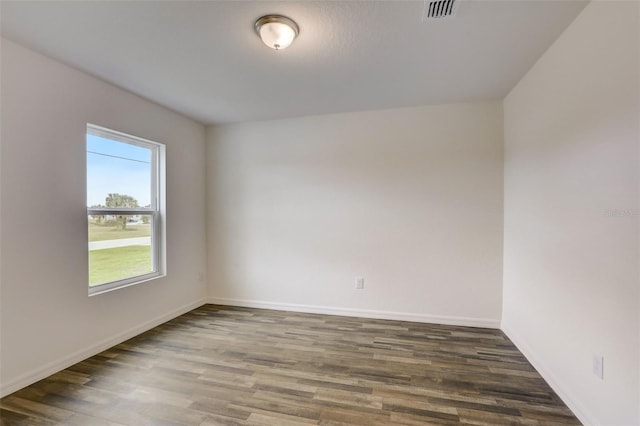 empty room featuring dark hardwood / wood-style floors