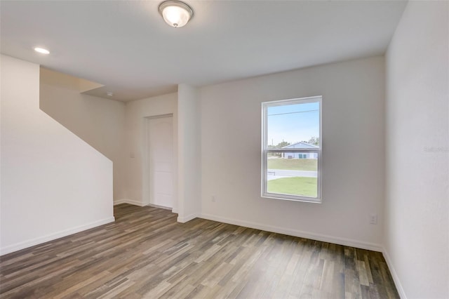 unfurnished room featuring hardwood / wood-style floors