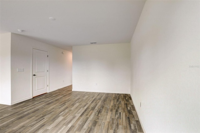 empty room featuring dark hardwood / wood-style floors