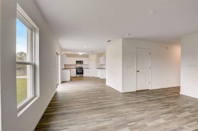 unfurnished living room featuring light hardwood / wood-style flooring