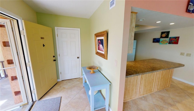 interior space featuring light tile patterned flooring