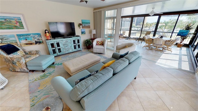 tiled living room with ceiling fan