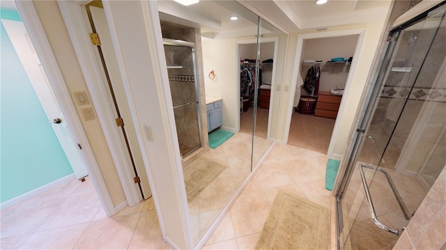 bathroom featuring tile patterned flooring and a shower with door