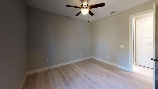 spare room featuring ceiling fan and light wood-type flooring