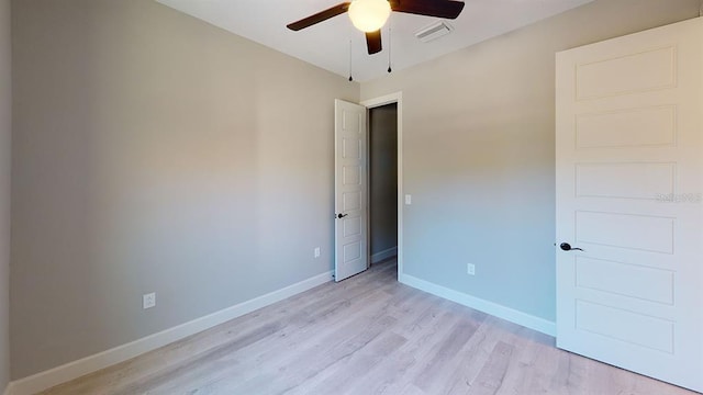 unfurnished bedroom featuring ceiling fan and light wood-type flooring