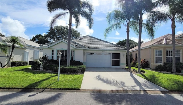 view of front facade with a garage and a front yard