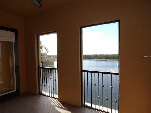 balcony featuring a water view