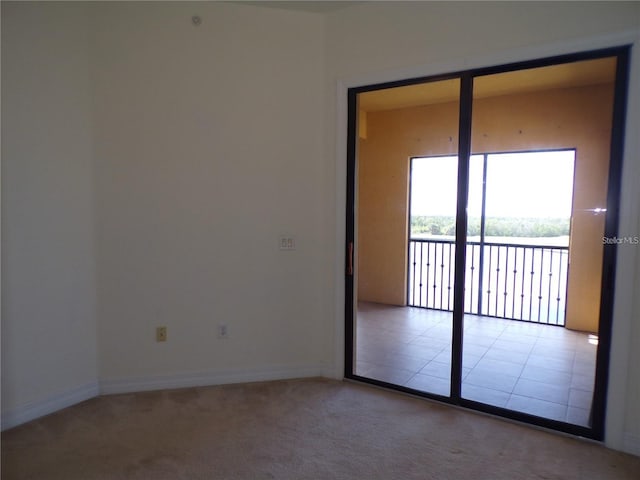 unfurnished room featuring carpet flooring