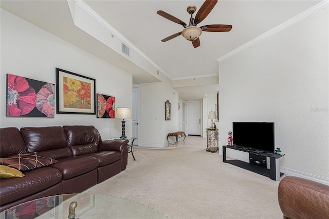 living room featuring light colored carpet, ceiling fan, and crown molding