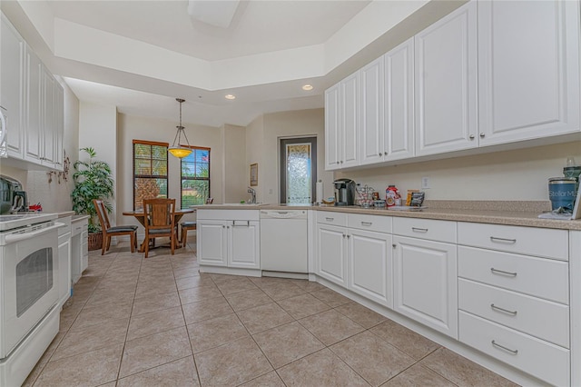 kitchen with white appliances, pendant lighting, sink, white cabinets, and light tile flooring