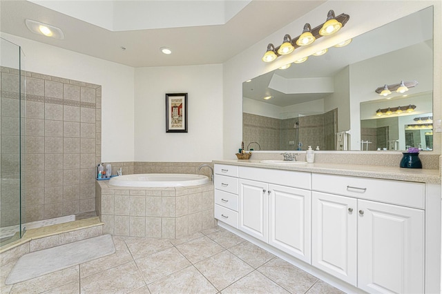 bathroom featuring vanity, shower with separate bathtub, and tile floors