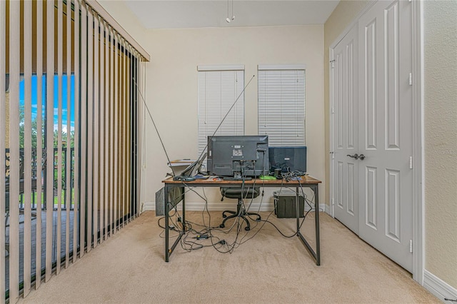 home office featuring light carpet