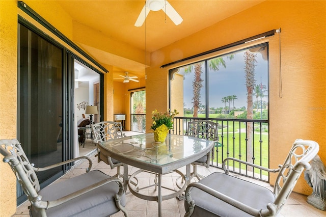 sunroom / solarium featuring ceiling fan