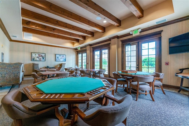 playroom featuring french doors, dark carpet, and beamed ceiling