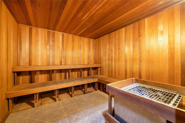 view of sauna / steam room with wooden walls and wooden ceiling