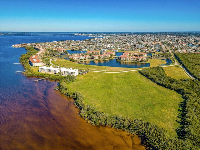 birds eye view of property with a water view