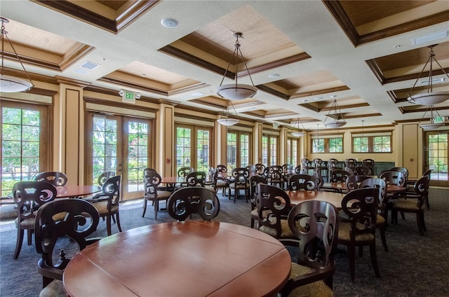 dining space featuring coffered ceiling, french doors, and a wealth of natural light