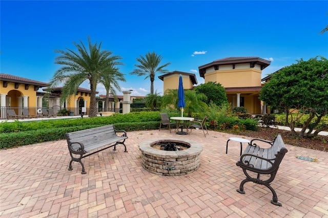 view of patio with a fire pit