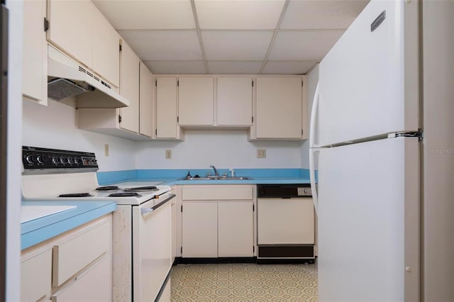 kitchen featuring premium range hood, light tile floors, a drop ceiling, white appliances, and white cabinetry