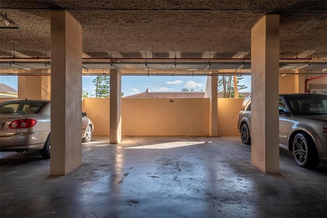 garage featuring a carport