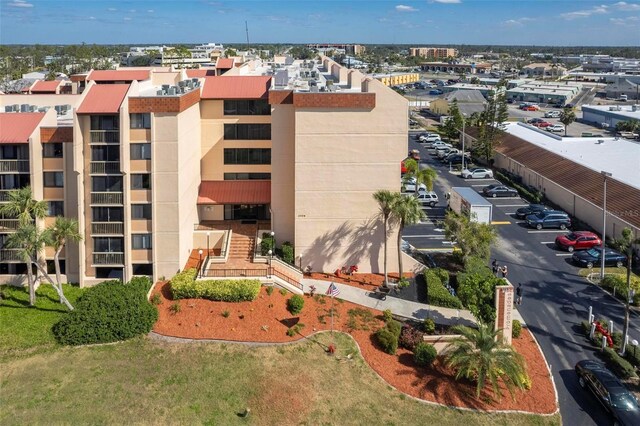 3006 Caring Way Unit 325, Port Charlotte, FL 33952 - view of building exterior with uncovered parking