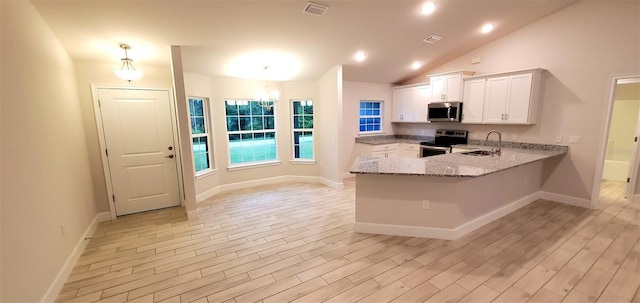 kitchen featuring sink, decorative light fixtures, appliances with stainless steel finishes, kitchen peninsula, and white cabinets