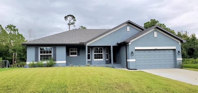 view of front facade featuring a garage and a front yard