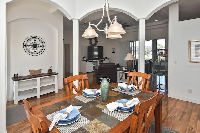 dining room featuring hardwood / wood-style floors and an inviting chandelier