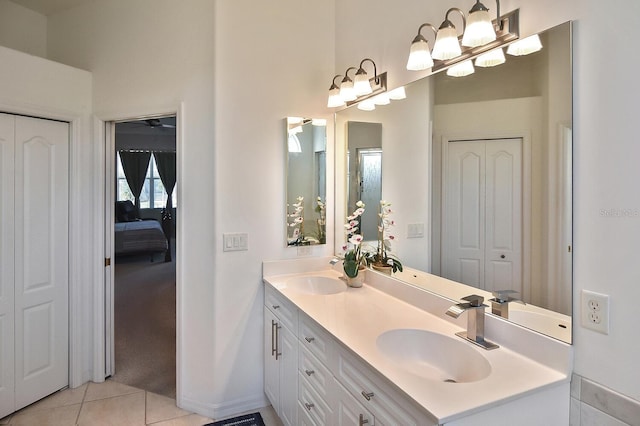 bathroom with tile flooring, double sink, and oversized vanity