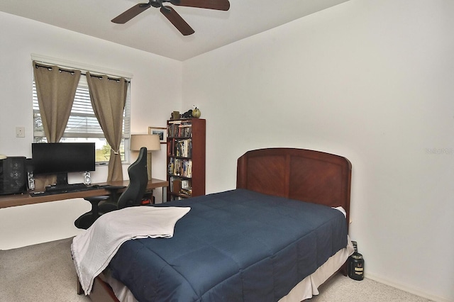 bedroom with ceiling fan and light colored carpet