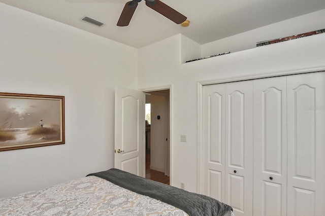 bedroom with a closet, ceiling fan, and wood-type flooring