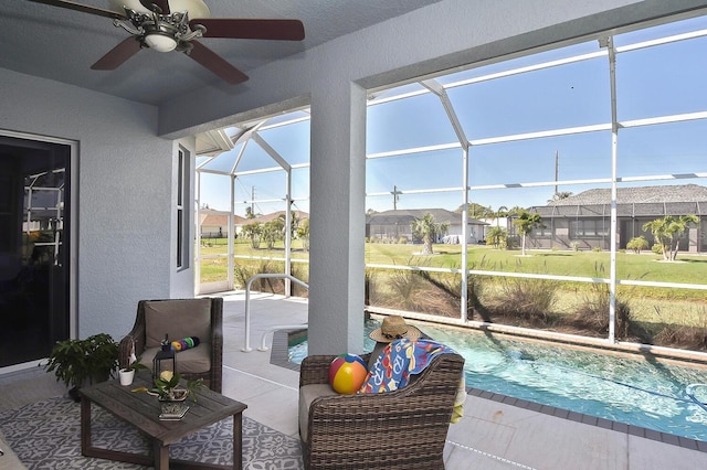 sunroom / solarium featuring ceiling fan and a healthy amount of sunlight