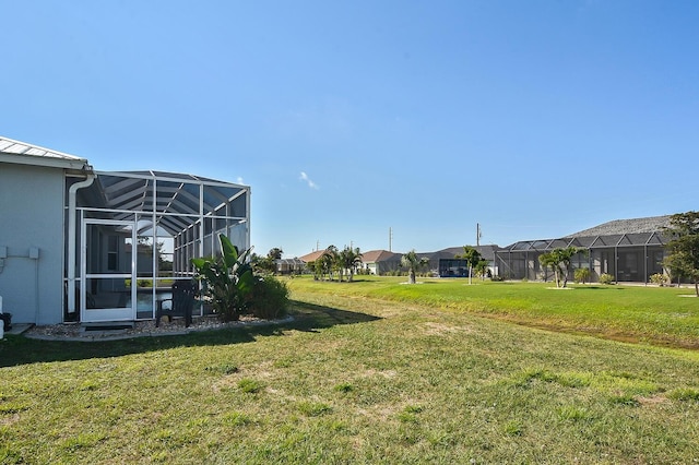 view of yard featuring a lanai