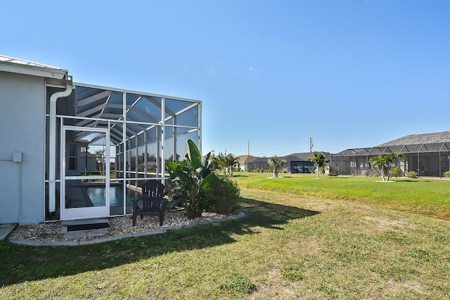 view of yard with a lanai