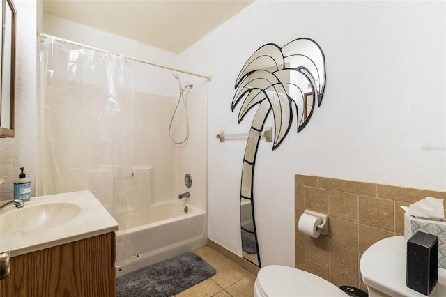 full bathroom featuring toilet, shower / bath combo, vanity, tile walls, and tile floors