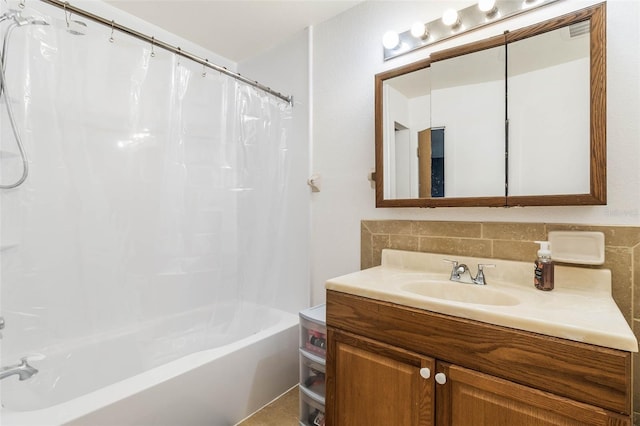 bathroom with large vanity, shower / tub combo with curtain, backsplash, and tile walls