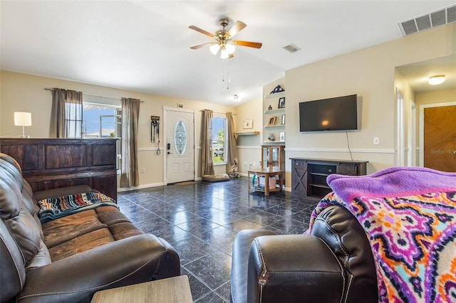 tiled living room with vaulted ceiling and ceiling fan