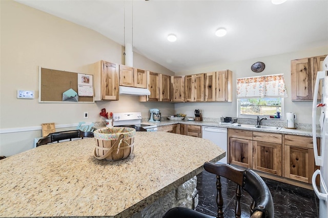 kitchen featuring white dishwasher, vaulted ceiling, a breakfast bar area, dark tile floors, and range