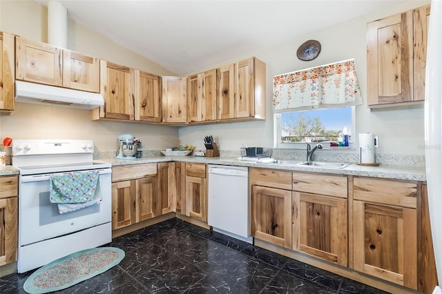 kitchen with white appliances, dark tile floors, lofted ceiling, and sink