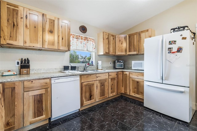 kitchen with white appliances, dark tile floors, sink, and lofted ceiling